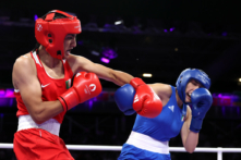 Imane Khelif of Team Algeria and Angela Carini of Team Italy exchange punches during the Women's 66kg preliminary round match on Day 6 of the Olympic Games Paris 2024 at North Paris Arena in Paris on Aug. 1, 2024. (Richard Pelham/Getty Images)